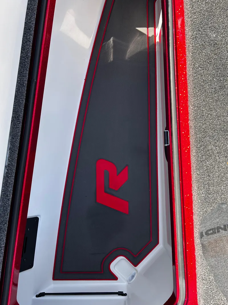 Slide: The Image of 2024 Ranger Z519 boat compartment with red and black design. - 10