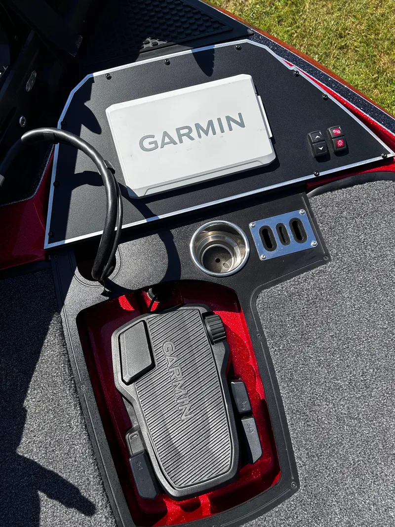 Slide: The Image of 2024 Ranger Z519 boat dashboard with Garmin electronics and foot pedal controls. - 11