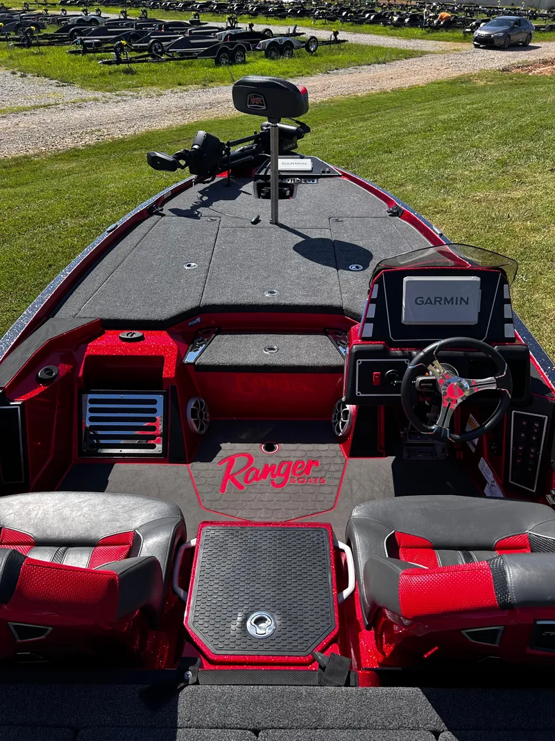 Slide: The Image of 2024 Ranger Z519 boat interior with Garmin system, red accents, and dual seating. - 14