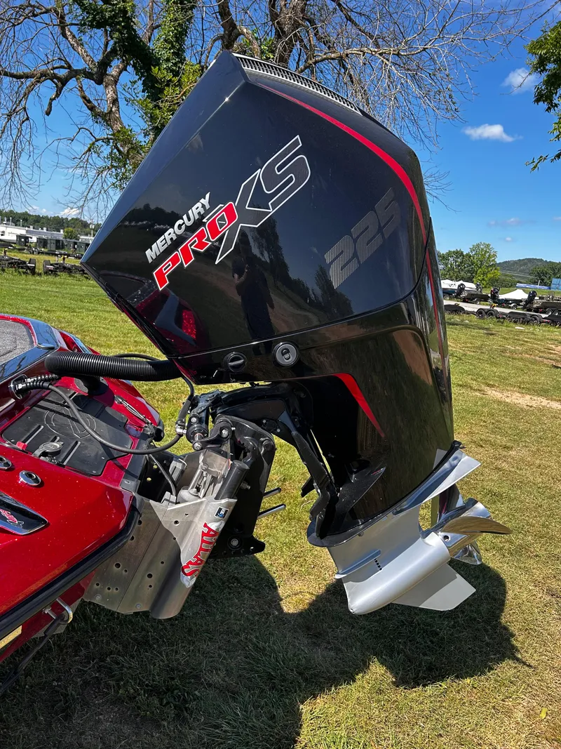 Slide: The Image of 2024 Ranger Z519 boat with Mercury Pro XS 225 engine on grassy area. - 22