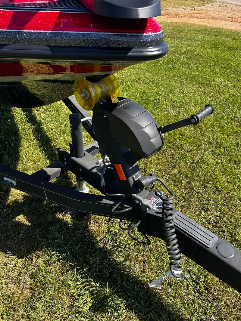 Slide: The Image of 2024 Ranger Z519 boat trailer hitch on grassy field. - 27