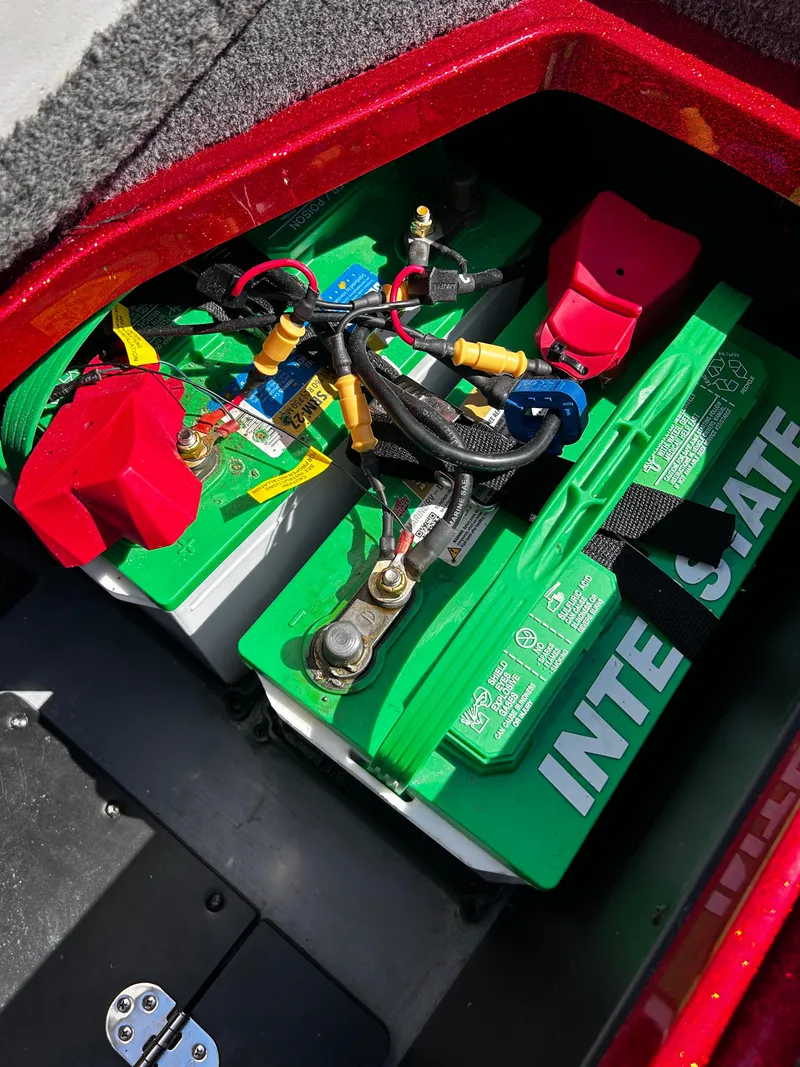 Slide: The Image of 2024 Ranger Z519 boat battery compartment with Interstate batteries and wiring. - 30