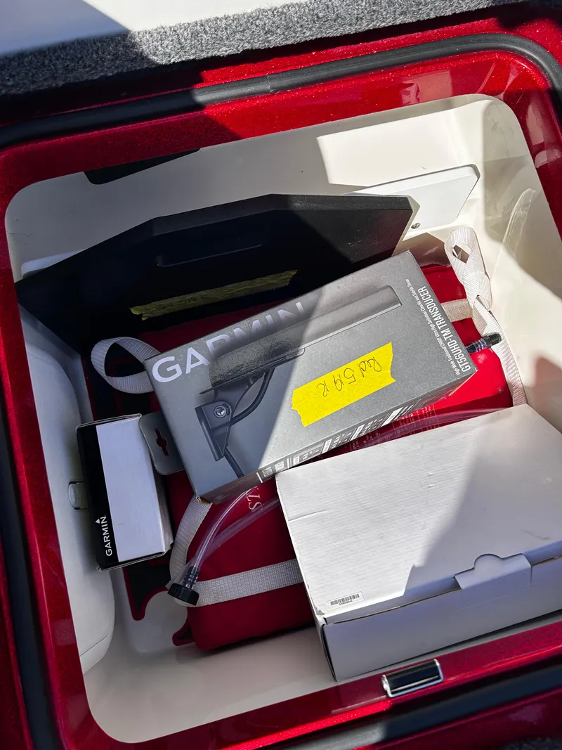 Slide: The Image of Storage compartment in 2024 Ranger Z519 boat with Garmin equipment and accessories. - 32