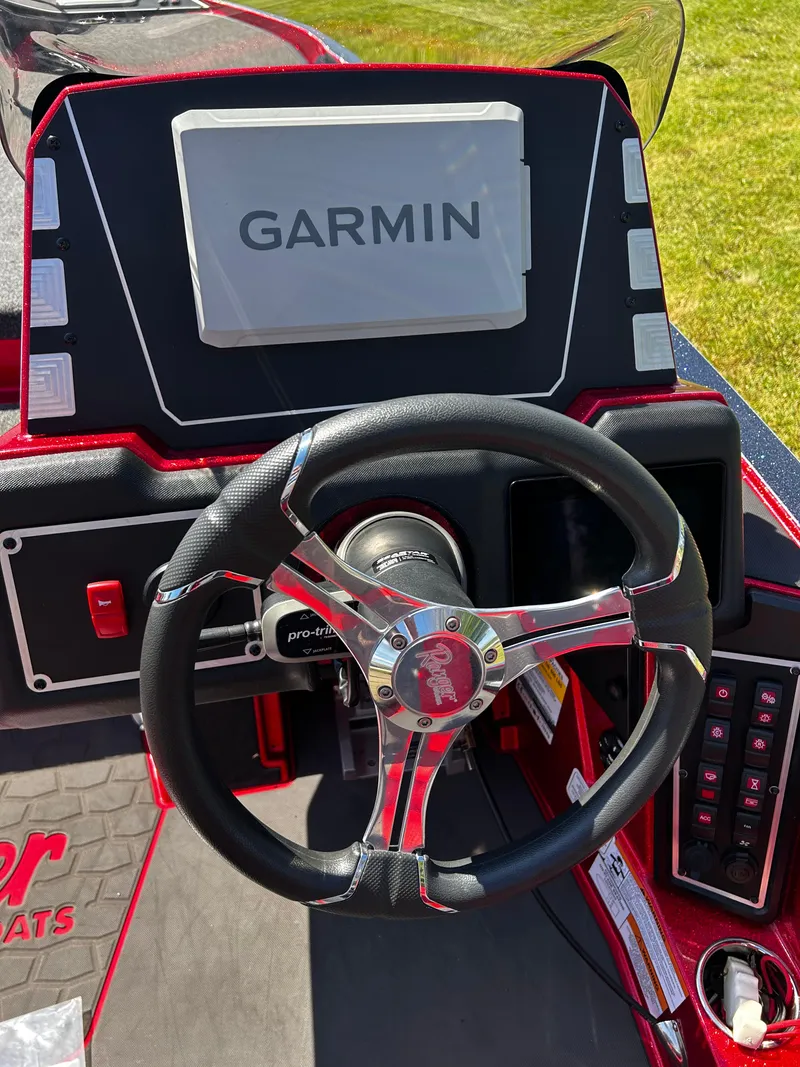 Slide: The Image of 2024 Ranger Z519 boat dashboard with Garmin display and steering wheel. - 6