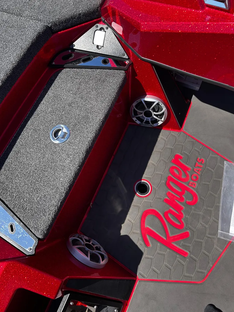 Slide: The Image of 2024 Ranger Z519 boat interior with red accents and logo. - 7