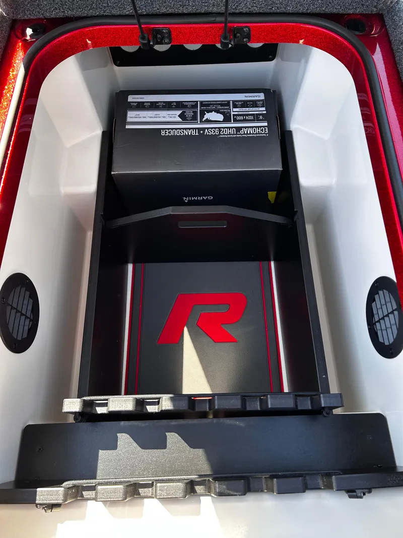 Slide: The Image of 2024 Ranger Z519 storage compartment with Garmin electronics and transducer. - 8