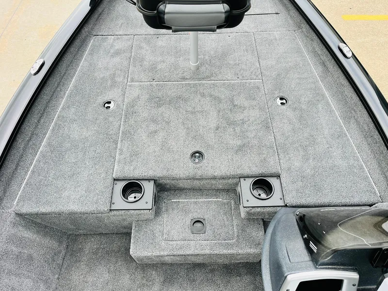 Slide: The Image of 2026 Tracker Pro Team 175 boat interior with gray carpet and seating. - 10