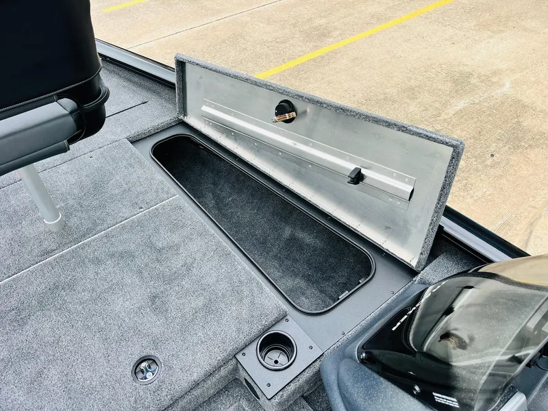 Slide: The Image of 2026 Tracker Pro Team 175 boat interior with open storage compartment. - 15