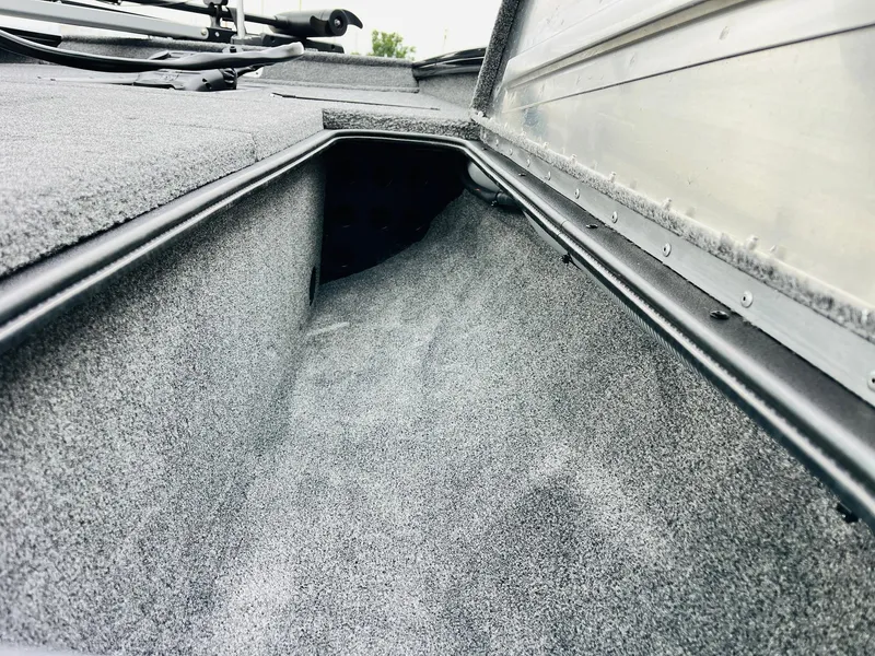 Slide: The Image of Interior view of 2026 Tracker Pro Team 175 boat storage compartment. - 16