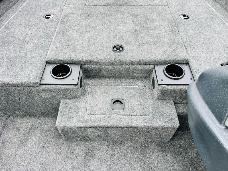 Slide: The Image of Interior of 2026 Tracker Pro Team 175 boat with cup holders and storage compartments. - 17