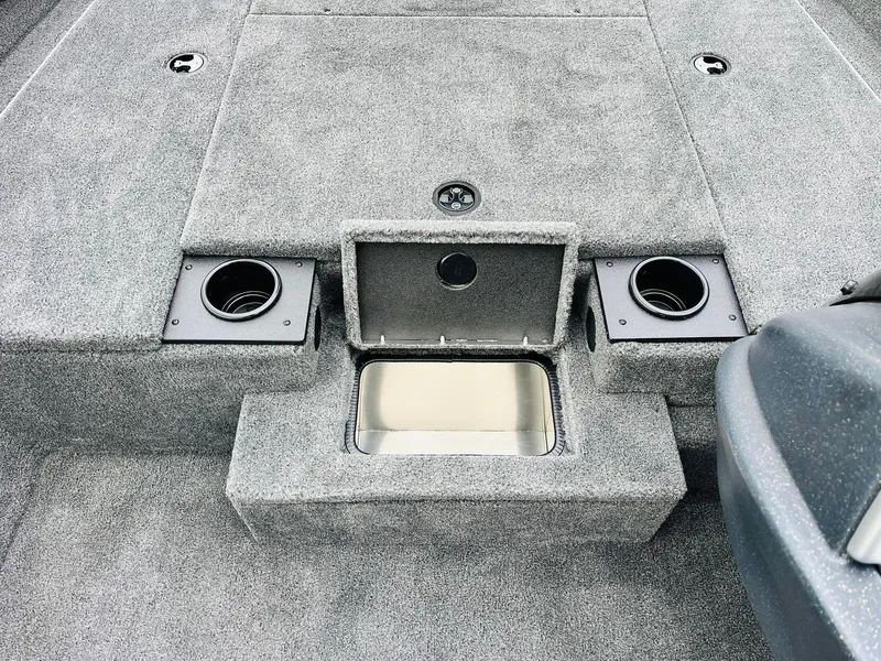 Slide: The Image of 2026 Tracker Pro Team 175 boat interior with storage compartments and cup holders. - 18