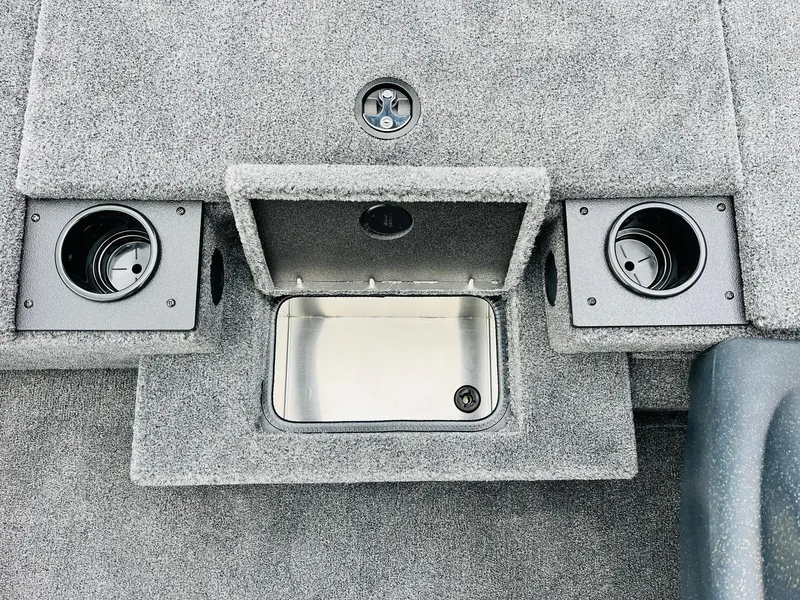 Slide: The Image of 2026 Tracker Pro Team 175 boat interior with cup holders and storage compartment. - 19