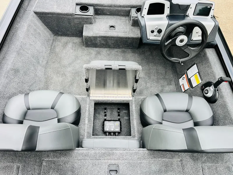 Slide: The Image of 2026 Tracker Pro Team 175 boat interior with steering wheel, seats, and control panel. - 23