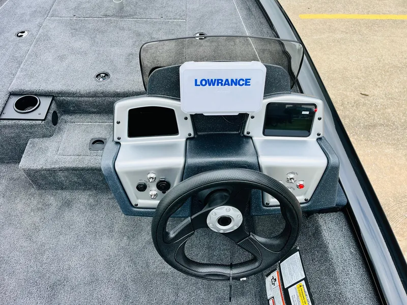 Slide: The Image of 2026 Tracker Pro Team 175 boat dashboard with Lowrance electronics and steering wheel. - 26