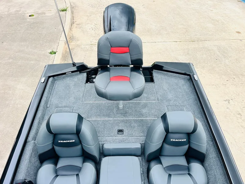 Slide: The Image of 2026 Tracker Pro Team 175 boat interior with gray and red seating. - 28