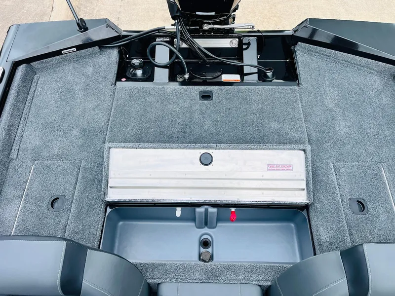 Slide: The Image of 2026 Tracker Pro Team 175 boat interior with carpeted deck and storage compartments. - 30