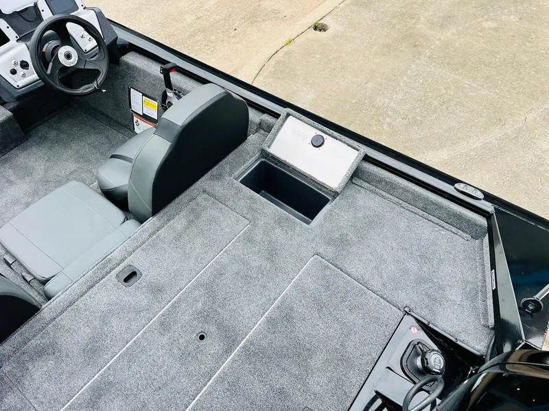 Slide: The Image of 2026 Tracker Pro Team 175 boat interior with gray seating and steering wheel. - 36