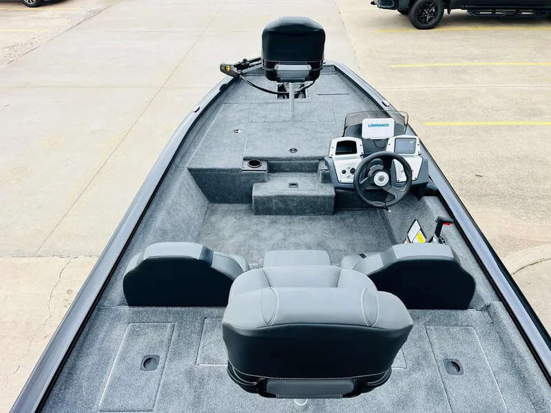 Slide: The Image of 2026 Tracker Pro Team 175 boat interior with steering console and seating. - 6