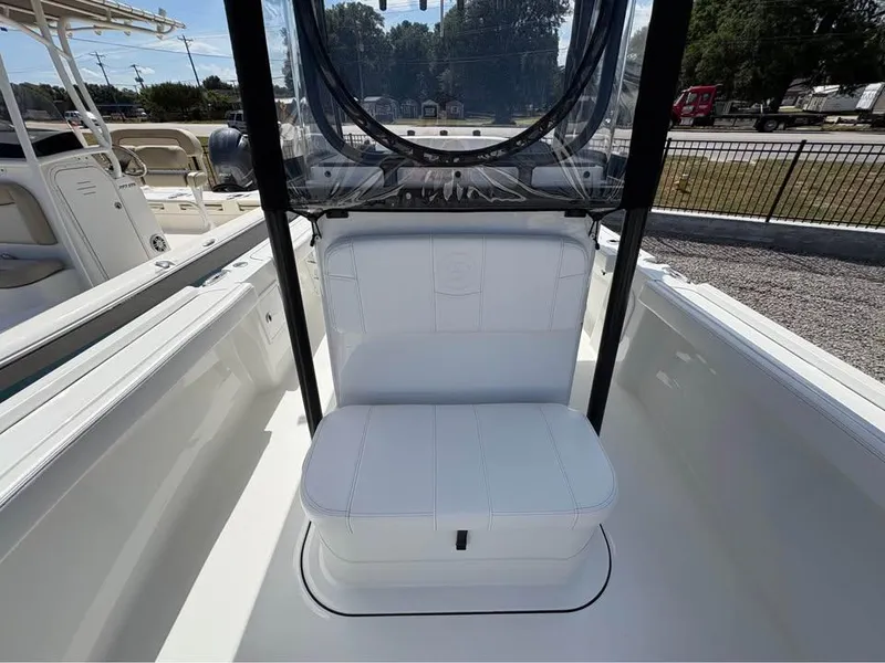 Slide: The Image of 2025 Parker 23SE Center Console boat interior with white seating and clear windshield. - 15