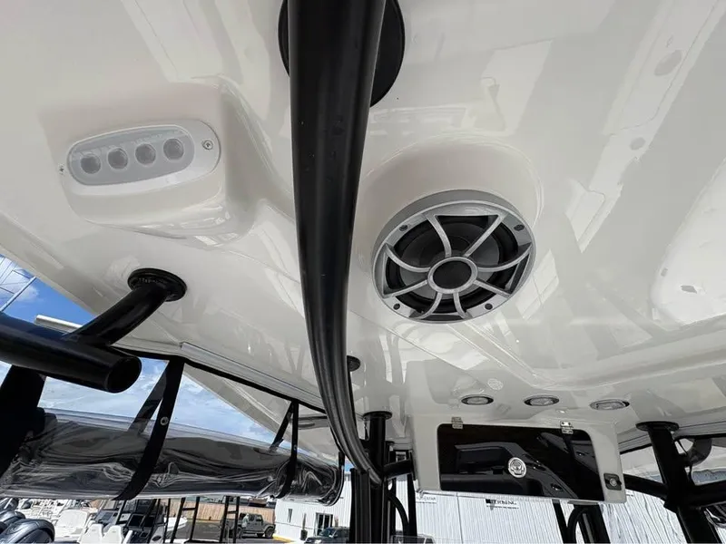 Slide: The Image of 2025 Parker 23SE Center Console boat interior with speaker and lighting features. - 18