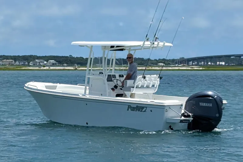 Slide: The Image of Manufacturer Provided Image: 2025 Parker 23SE Center Console boat on water with Yamaha outboard motor. - 4