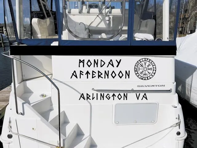 Slide: The Image of 1998 Silverton 322 Motor Yacht docked, named "Monday Afternoon," Arlington VA. - 2