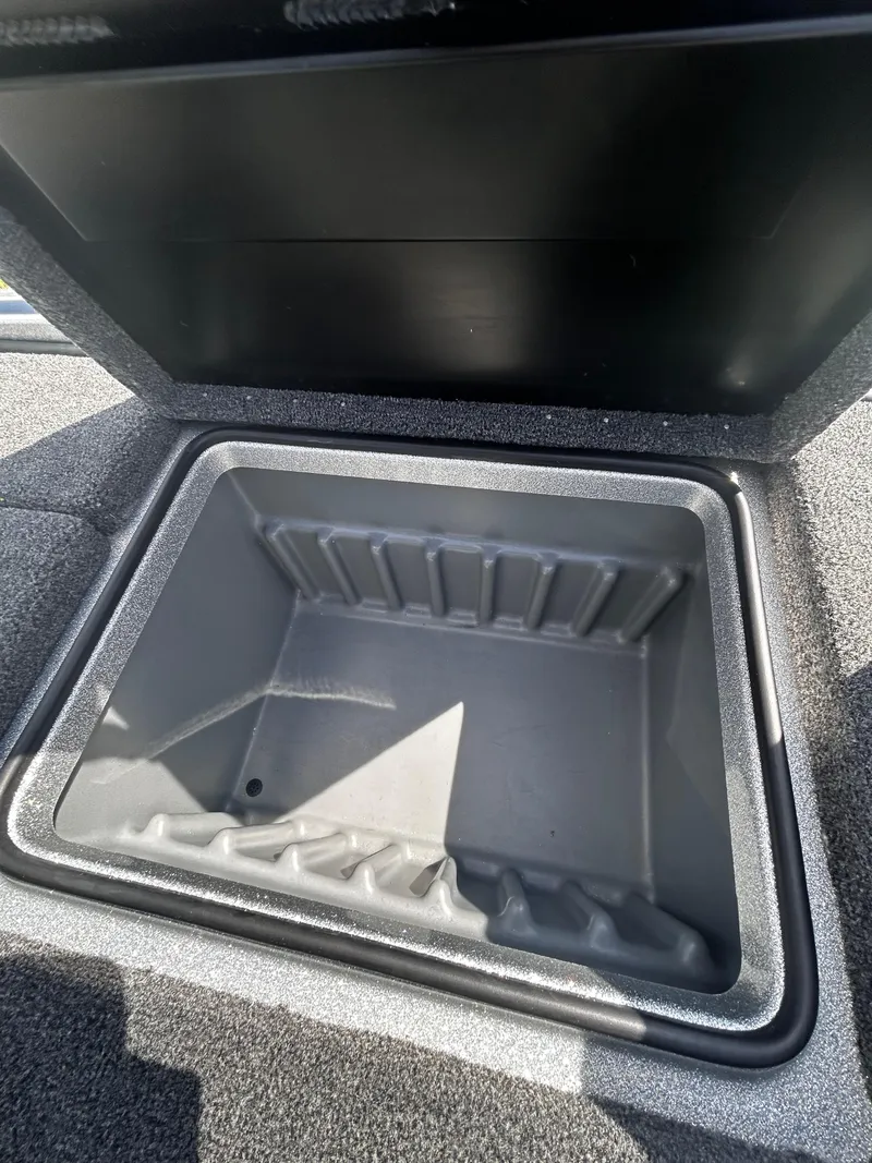 Slide: The Image of Open storage compartment in 2024 Triton 21XP boat. - 29