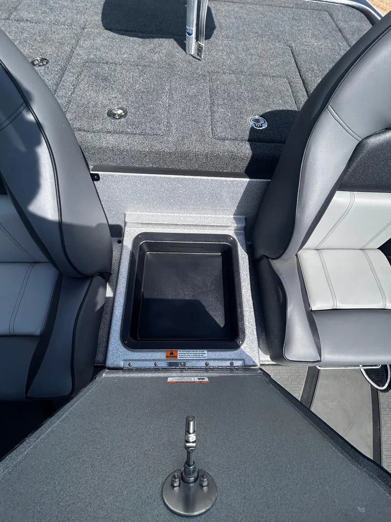 Slide: The Image of 2024 Triton 21XP boat interior with storage compartment and seating. - 38