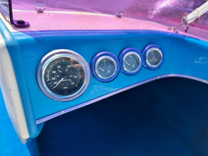 Slide: The Image of Dashboard of a 1987 Bahner 19 BR boat with speedometer and gauges. - 15