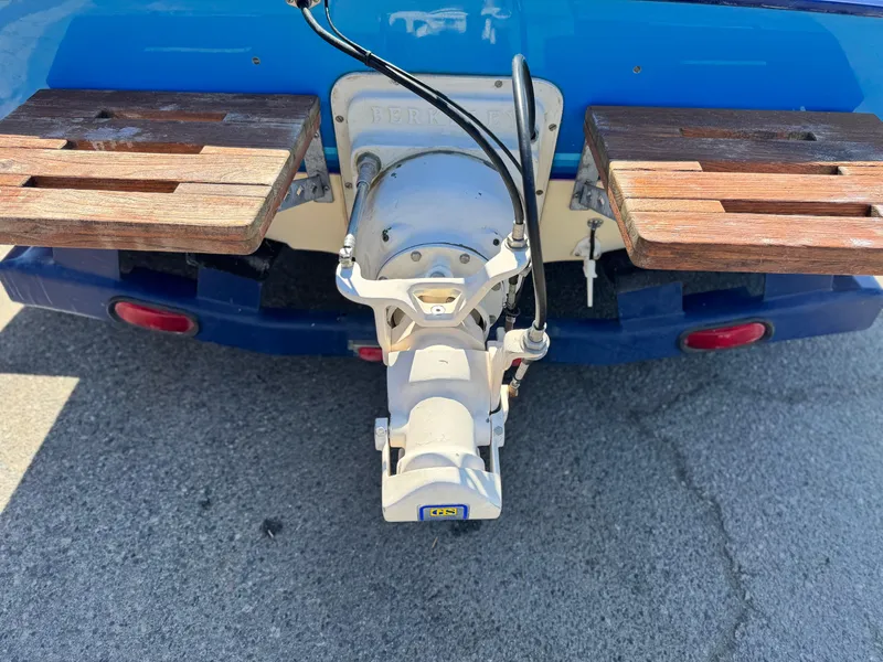 Slide: The Image of Rear view of a 1987 Bahner 19 BR boat with wooden platforms and a jet drive. - 6