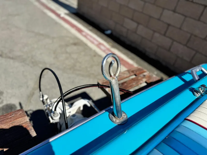 Slide: The Image of Blue Bahner 19 BR boat detail, 1987 model, featuring a metal eyelet and wooden accents. - 7