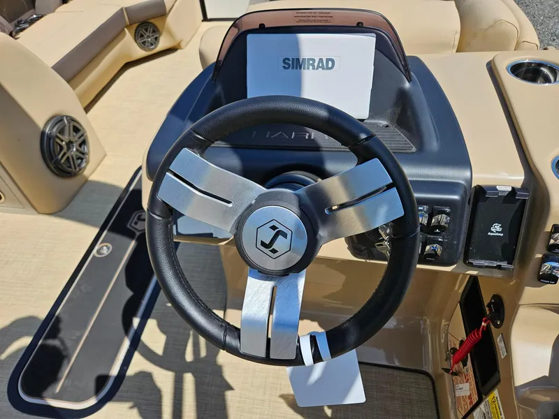 Slide: The Image of Steering wheel of 2025 Harris Sunliner 230 boat with Simrad navigation system. - 10