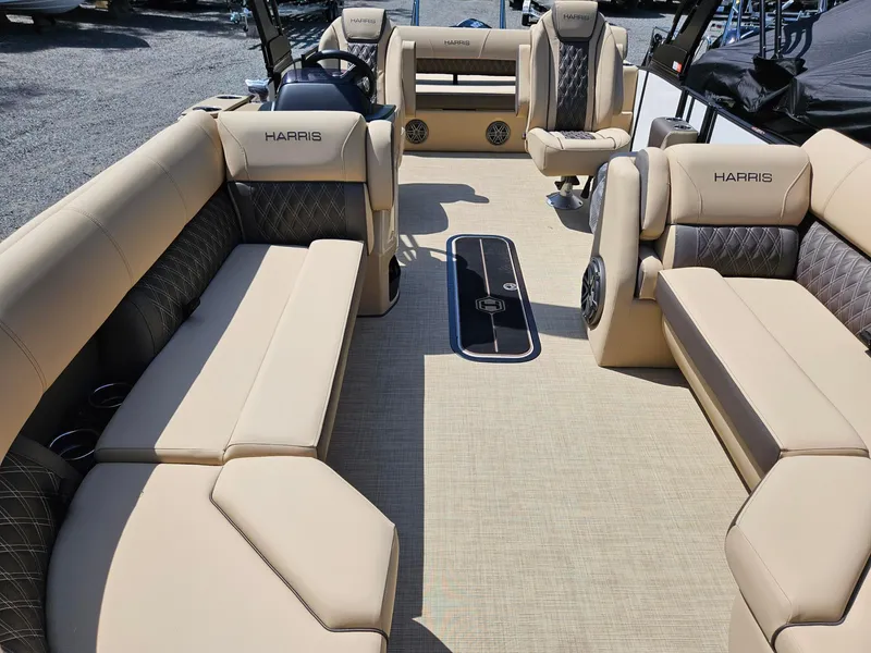 Slide: The Image of 2025 Harris Sunliner 230 pontoon boat interior with beige seating and modern design. - 4