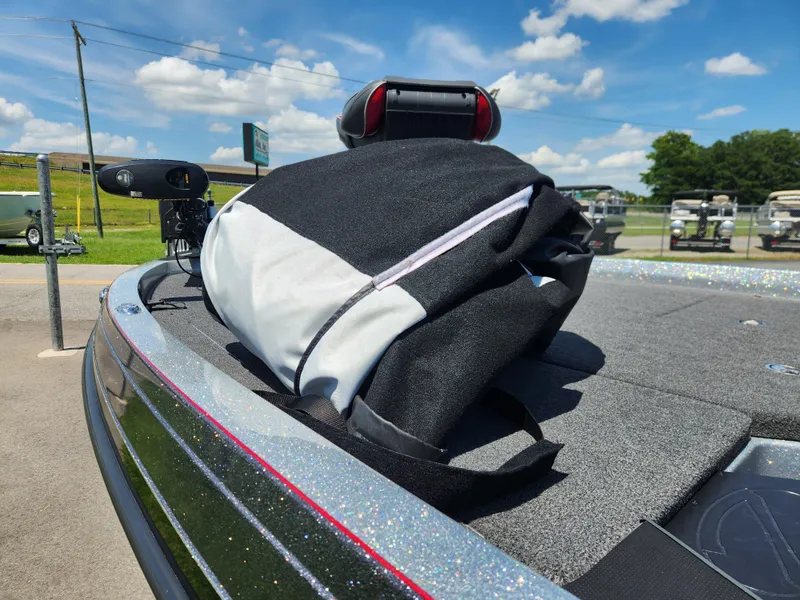 Slide: The Image of 2019 Ranger Z519L boat deck with a black and white bag under a clear blue sky. - 15