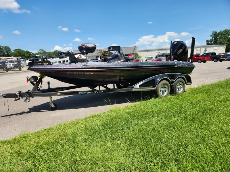 Slide: The Image of 2019 Ranger Z519L boat on trailer in outdoor setting, sunny day. - 7
