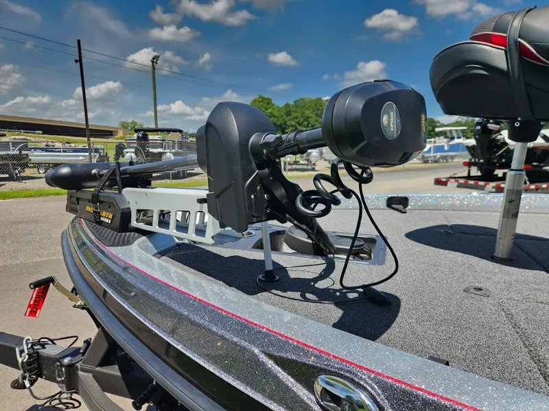 Slide: The Image of 2019 Ranger Z519L boat with Minn Kota trolling motor under a clear blue sky. - 8