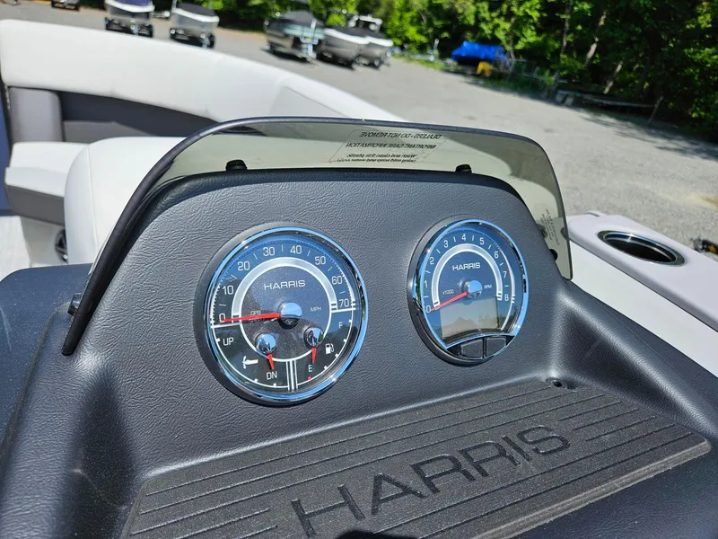 Slide: The Image of Dashboard of 2025 Harris Cruiser 210 boat with speedometer and tachometer. - 11
