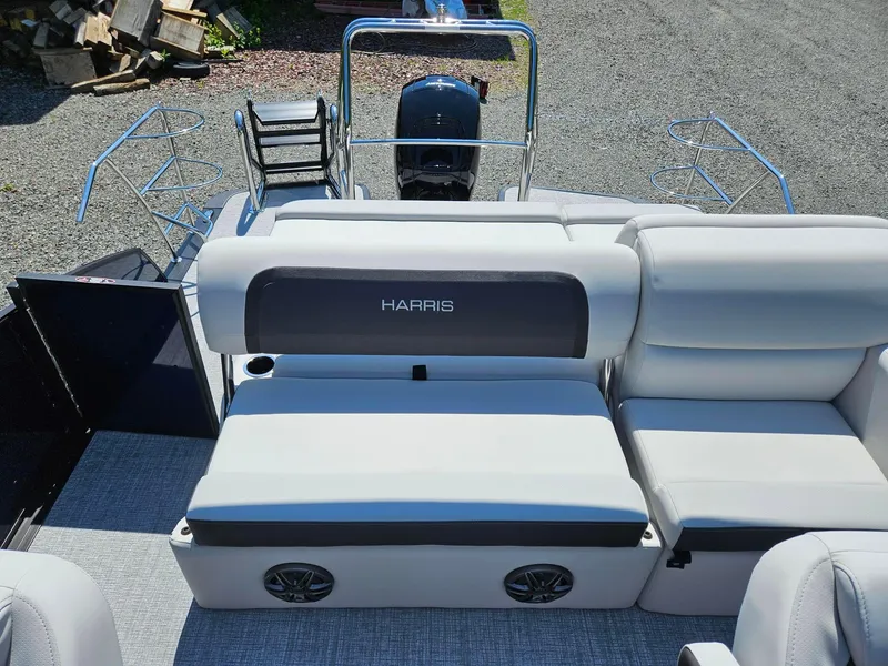 Slide: The Image of 2025 Harris Cruiser 210 pontoon boat with comfortable seating and sleek design. - 13