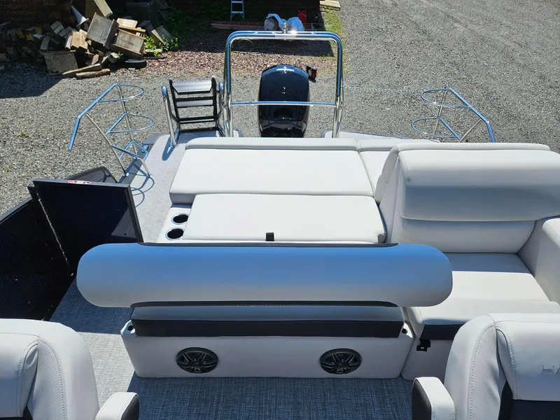 Slide: The Image of 2025 Harris Cruiser 210 pontoon boat interior with seating and cup holders. - 16