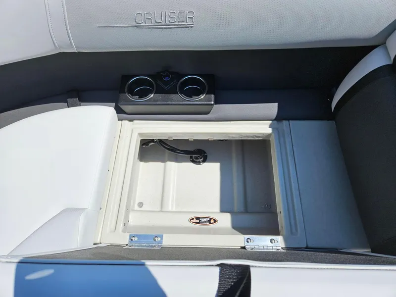 Slide: The Image of Interior storage compartment of 2025 Harris Cruiser 210 boat with cup holders. - 20
