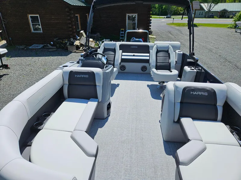 Slide: The Image of 2025 Harris Cruiser 210 pontoon boat interior with plush seating and modern design. - 6