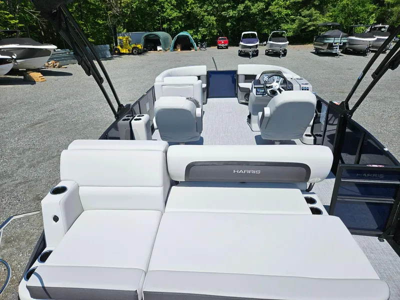 Slide: The Image of 2025 Harris Cruiser 210 pontoon boat with spacious seating and modern design. - 7