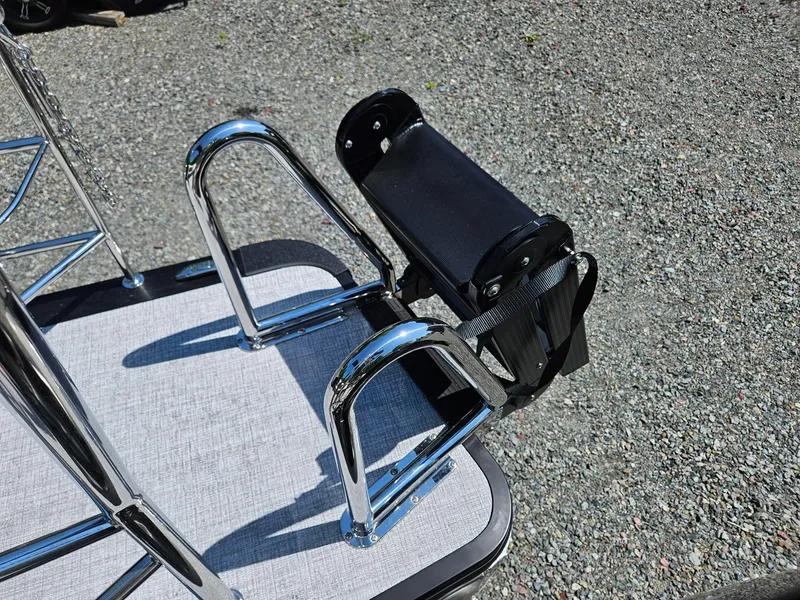 Slide: The Image of 2025 Harris Cruiser 210 boat ladder and platform on gravel surface. - 8