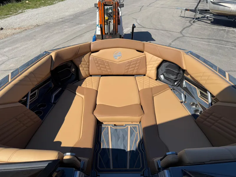 Slide: The Image of Luxurious interior of 2025 Tigé Ultré 25ZX boat with tan leather seating. - 14