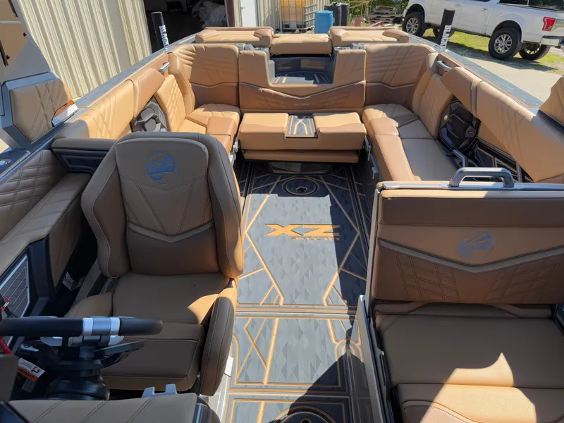 Slide: The Image of Luxurious interior of 2025 Tigé Ultré 25ZX boat with tan leather seating and modern design. - 16