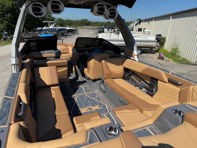 Slide: The Image of 2025 Tigé Ultré 25ZX boat interior with luxurious tan seating and modern design. - 7