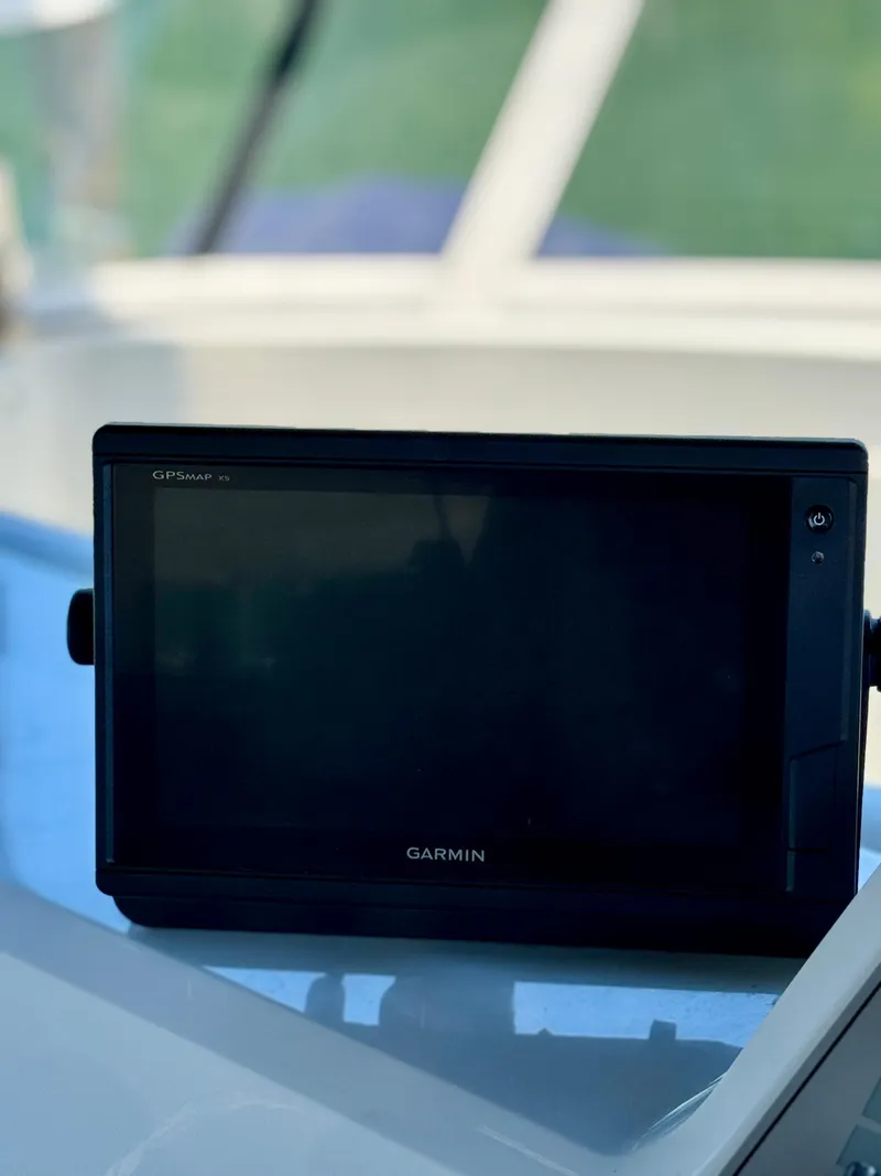 Slide: The Image of Garmin GPS device on 1997 Carver 405 Aft Cabin Motoryacht dashboard. - 11