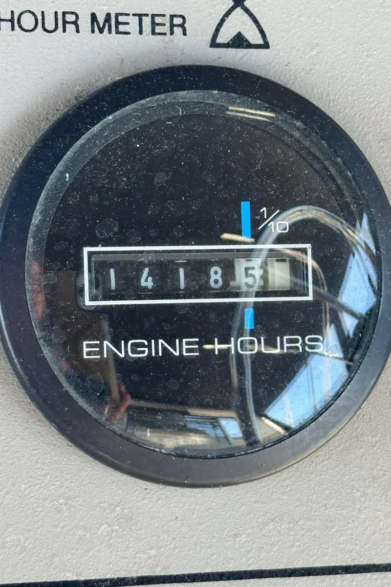 Slide: The Image of Hour meter showing 1418.5 engine hours on 1997 Carver 405 Aft Cabin Motoryacht. - 14