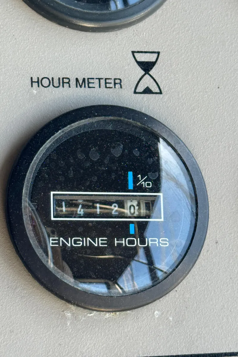 Slide: The Image of Hour meter showing 1412.0 engine hours on 1997 Carver 405 Aft Cabin Motoryacht. - 15
