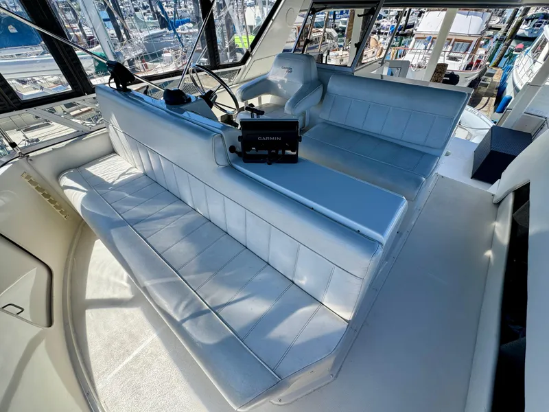 Slide: The Image of 1997 Carver 405 Aft Cabin Motoryacht interior with seating and navigation equipment. - 16